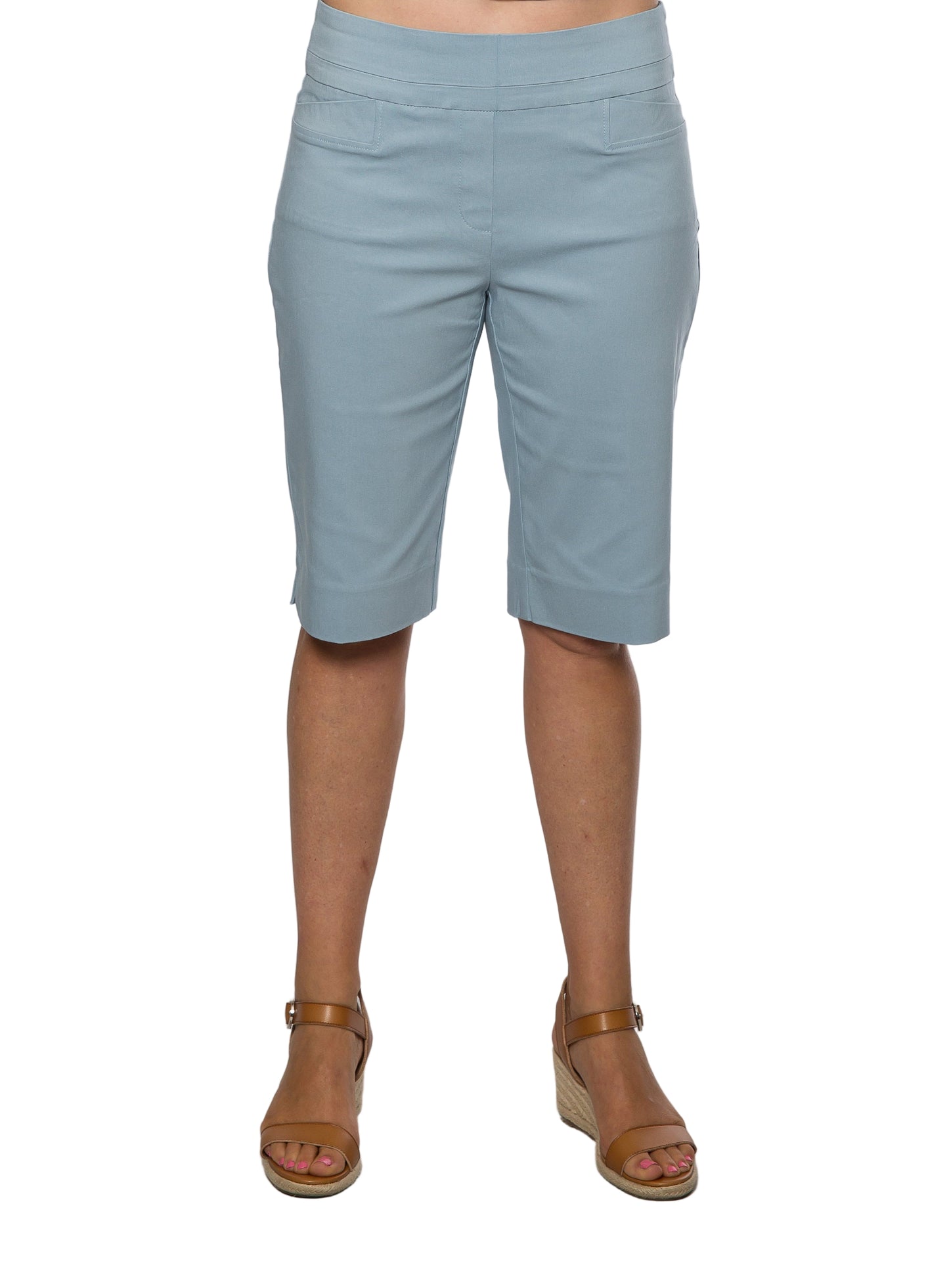 A pair of knee-length bengaline shorts in an ocean blue color, featuring back patch pockets, modeled against a plain background.