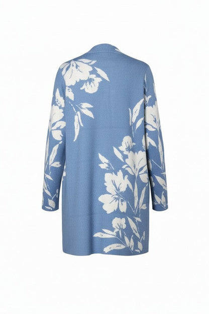 Blue cardigan with white floral pattern on a white background