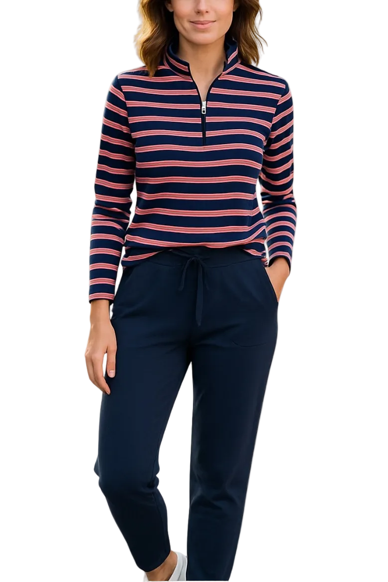 A woman modeling a long-sleeve quarter-zip pullover with navy, pink, and white horizontal stripes, paired with navy drawstring pants, against a plain white background.
