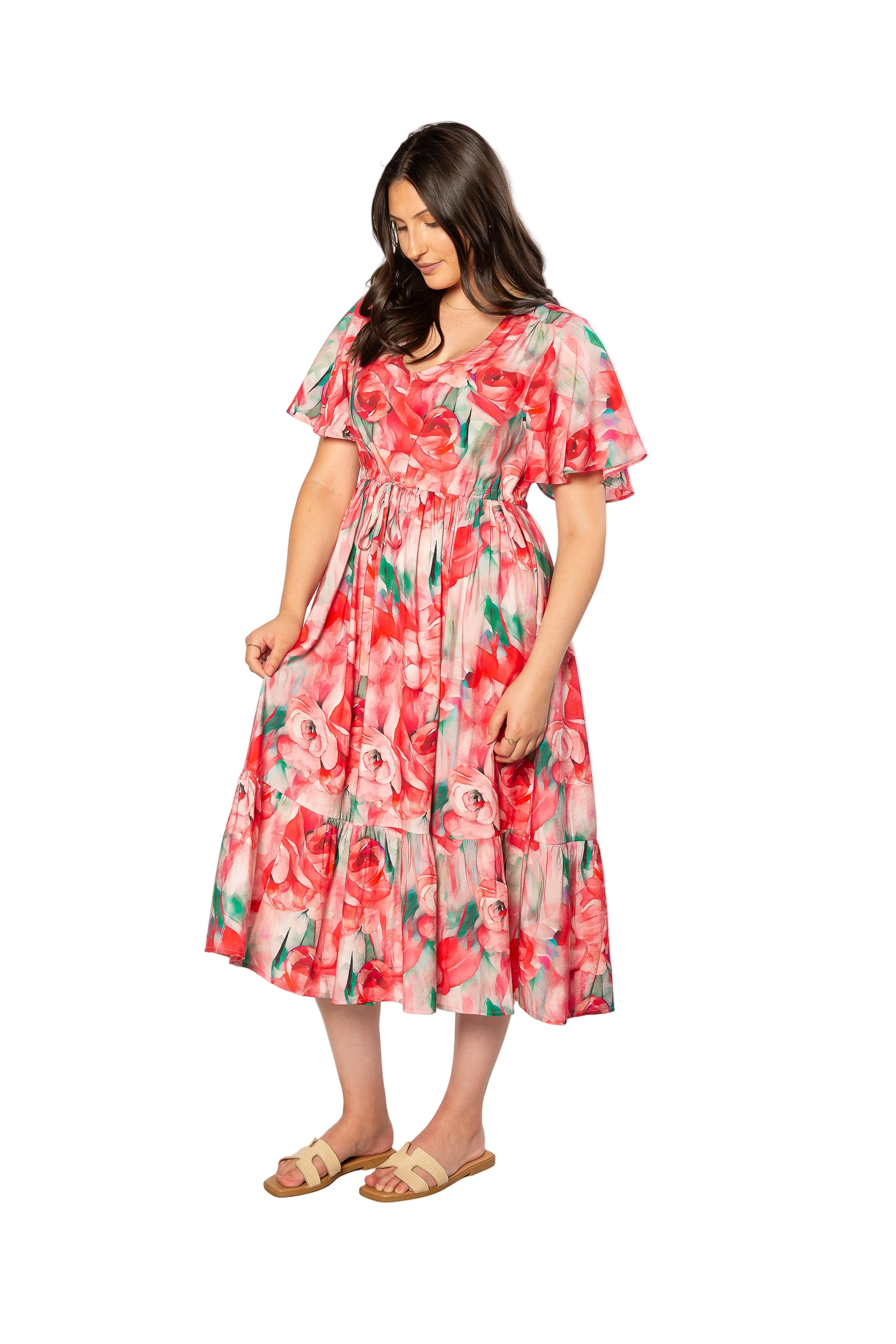 Woman wearing a floral dress on a white background