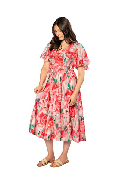 Woman wearing a floral dress on a white background