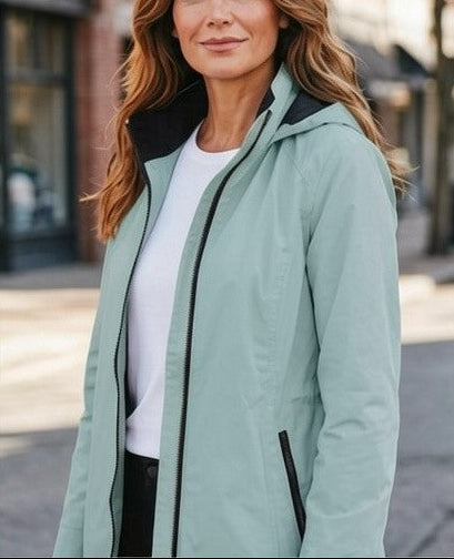 A woman modeling a light sage green hooded coat in a four-panel outdoor collage, showing front, back, and side views on a city street.
