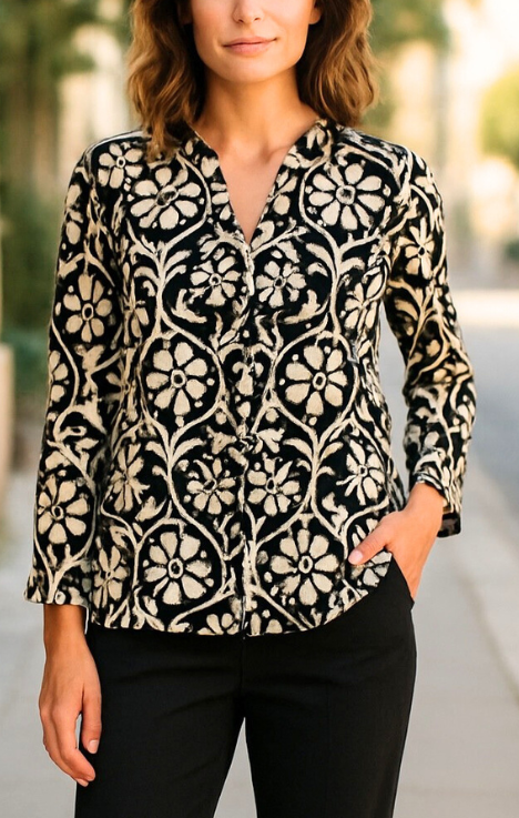 Tunic shirts with monochrome patterns worn by models, displayed on a white background.