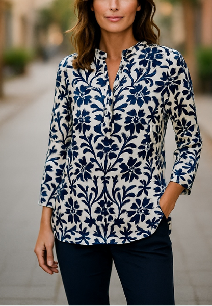 Tunic shirts with monochrome patterns worn by models, displayed on a white background.