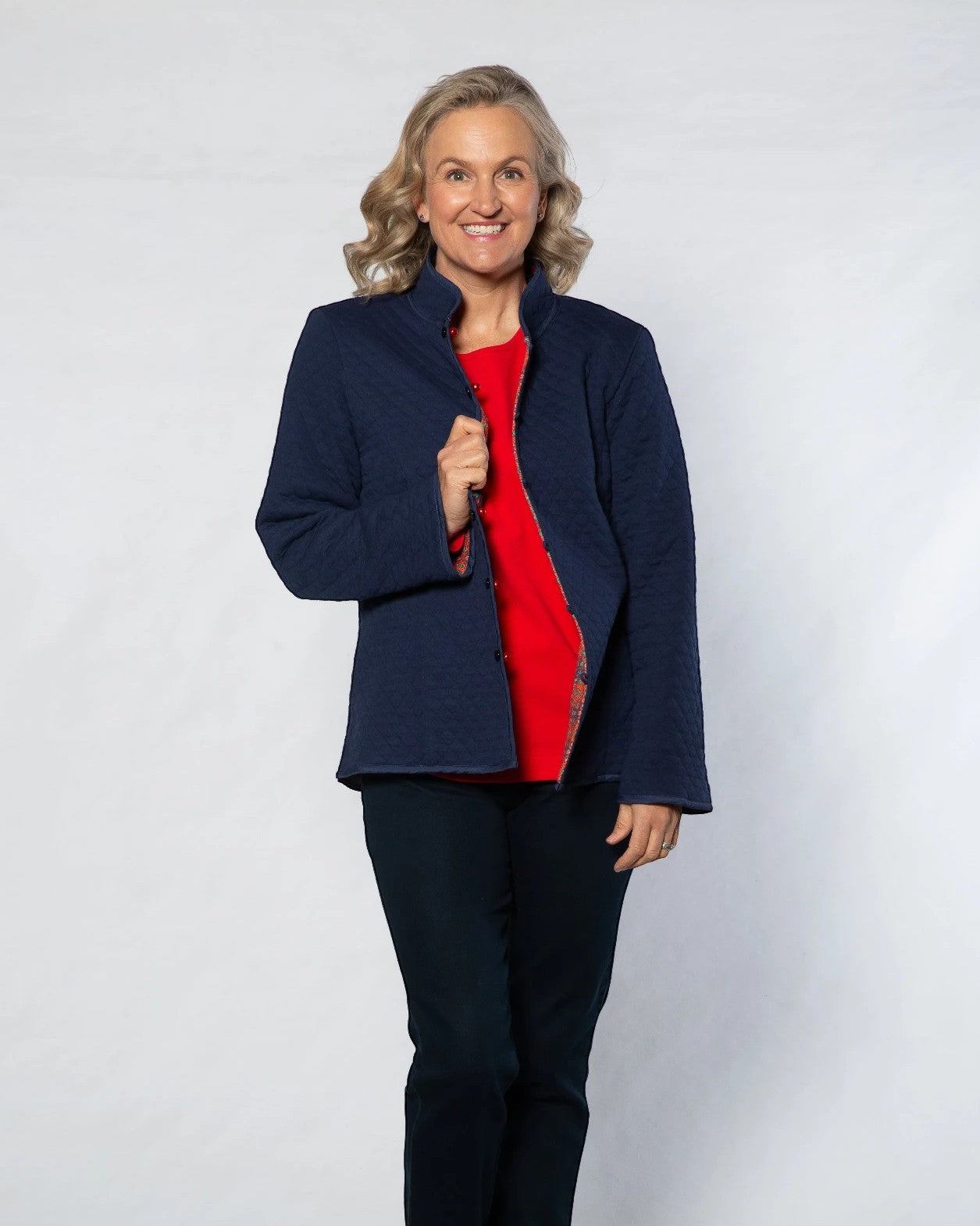 Equinox Clothing reversible oriental jacket in navy blue with red interior, featuring quilted cotton blend fabric.