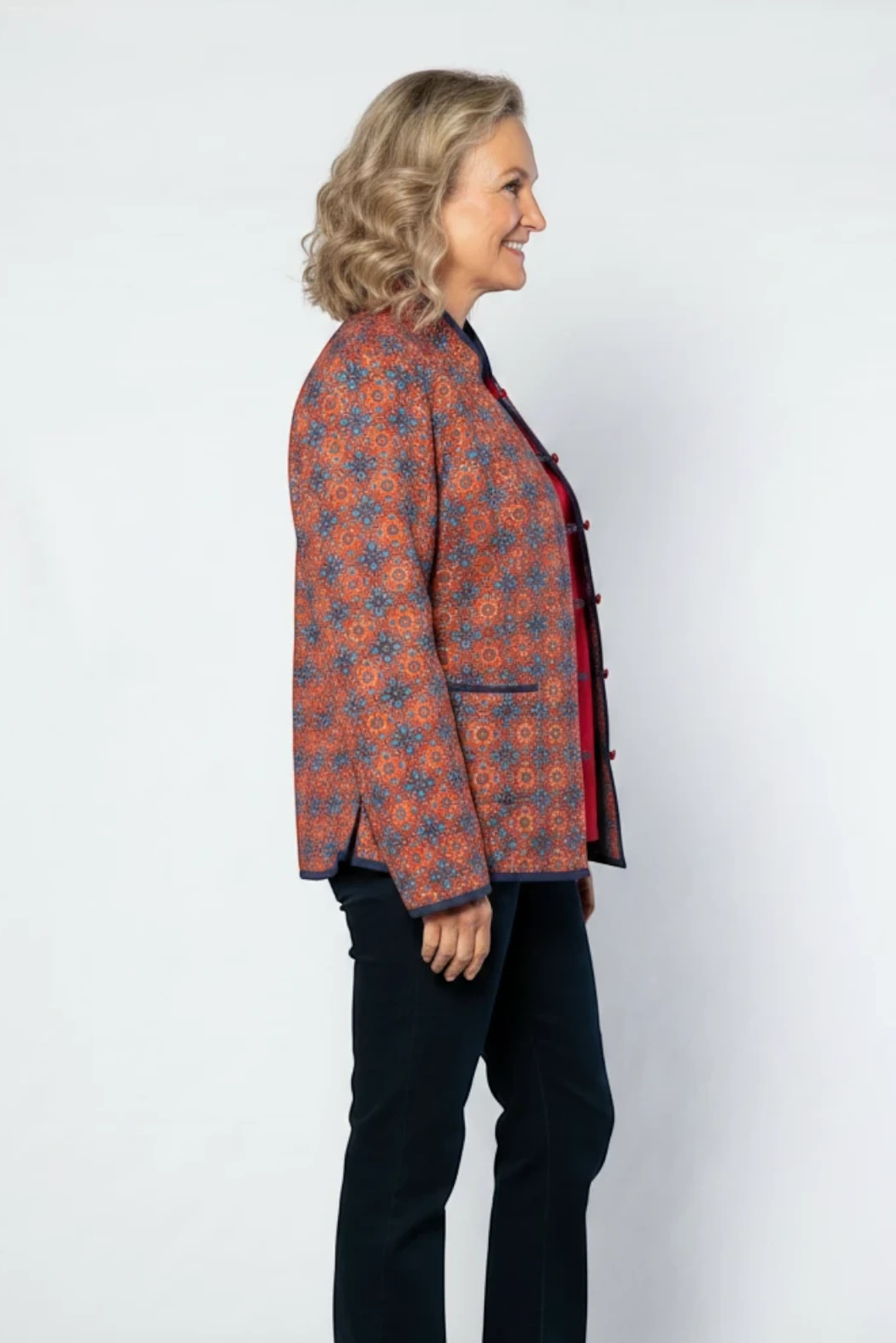 Equinox Clothing reversible oriental jacket in red and navy with quilted fabric, button loops, and patch pockets.