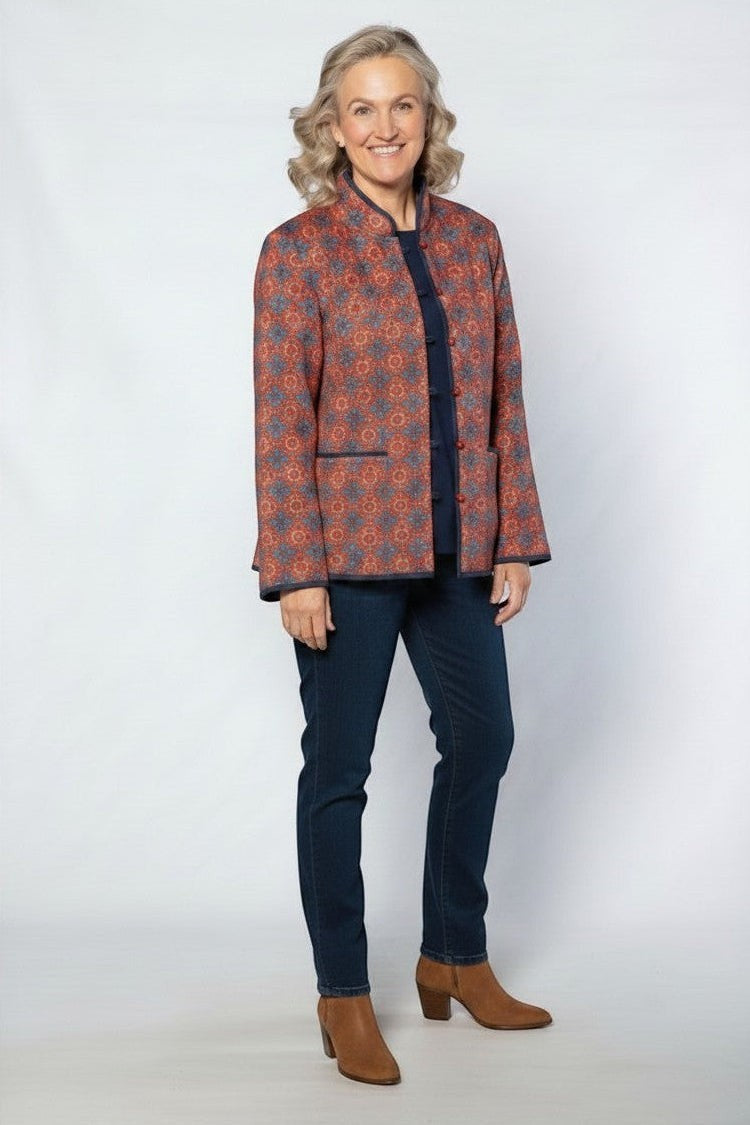 Equinox Clothing reversible oriental jacket in red and navy with quilted pattern, button loops, and patch pockets.