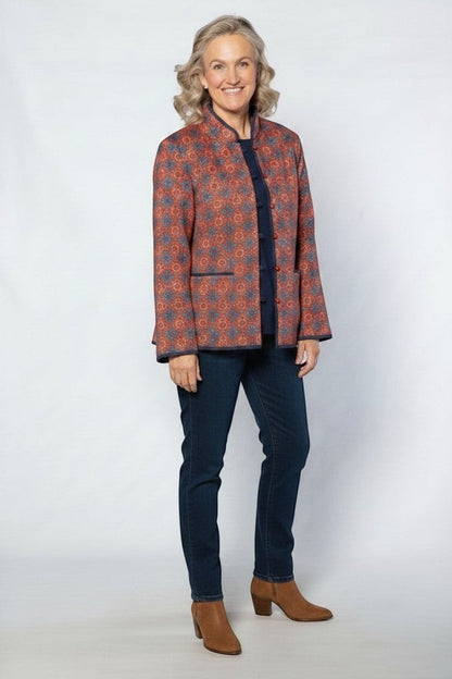 Equinox Clothing reversible oriental jacket in red and navy with quilted pattern, button loops, and patch pockets.