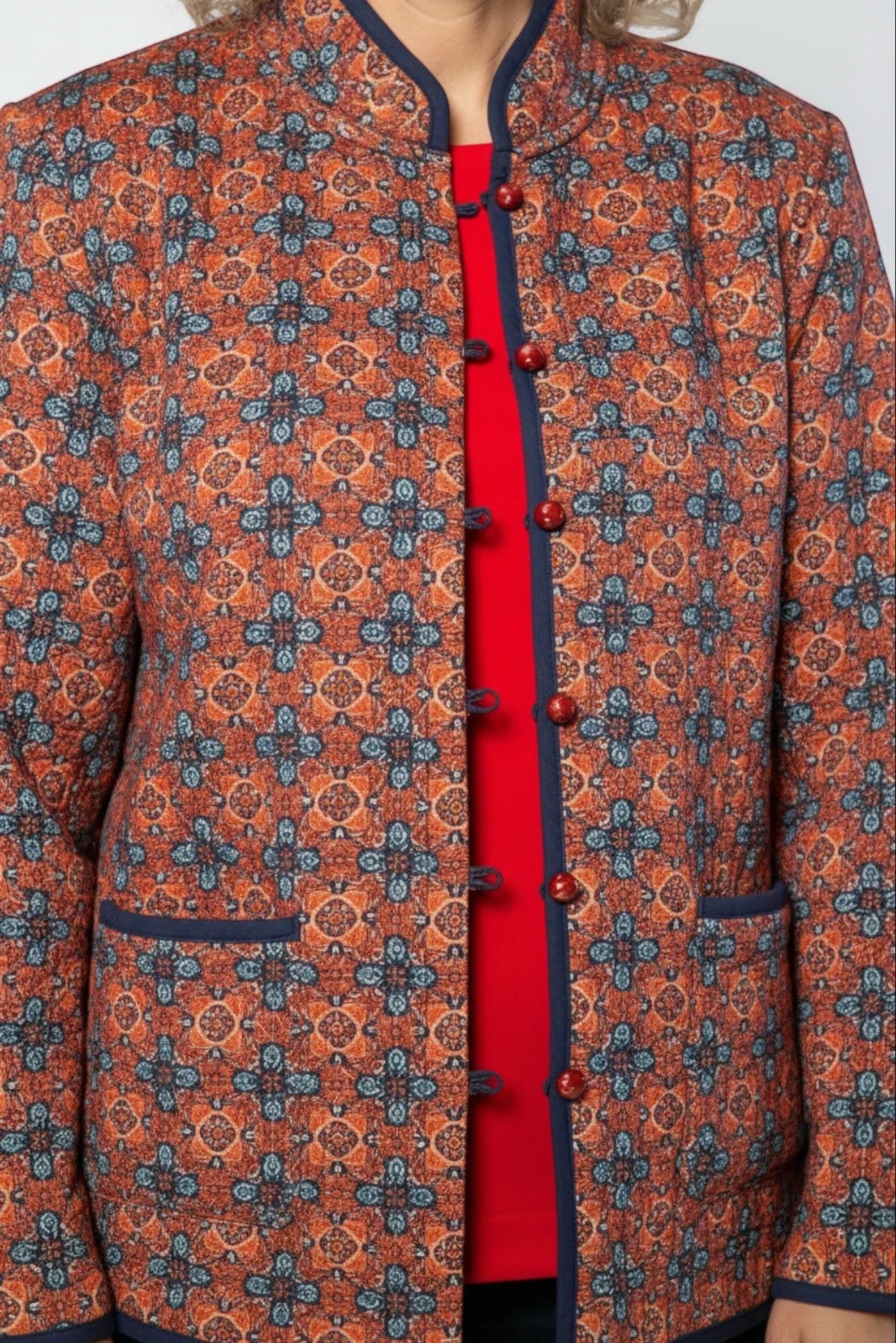 Equinox Clothing reversible oriental jacket in red and navy with quilted fabric, mandarin collar, and button closure.