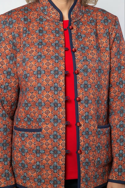 Equinox Clothing reversible oriental jacket in red and navy with quilted fabric, mandarin collar, and button closure.