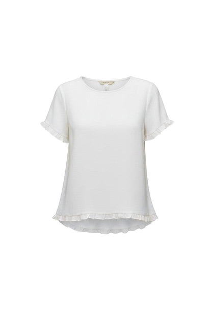 Equinox Clothing white Tencel short-sleeve top with feminine ruffle trim on the sleeves and hemline.